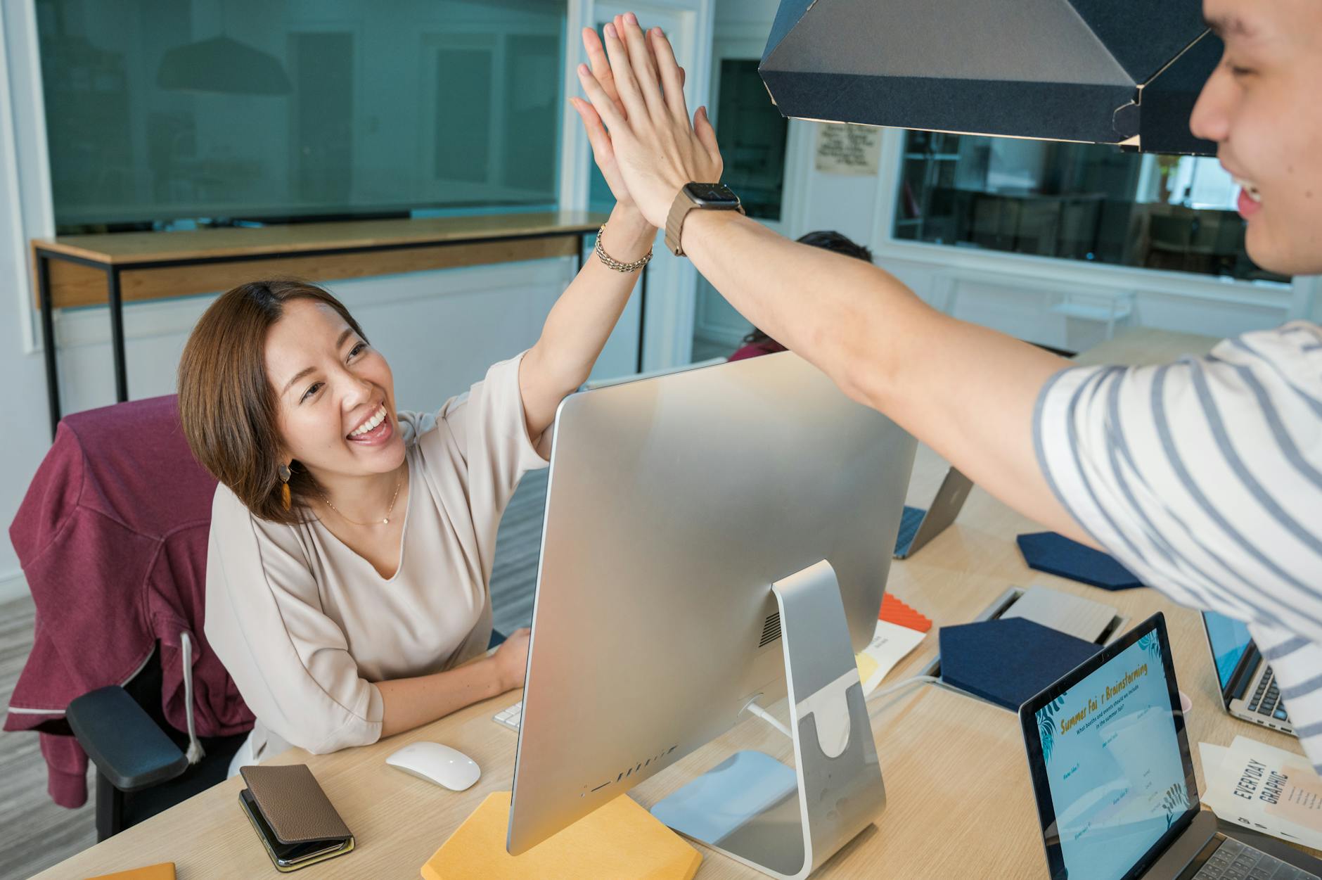 man and woman doing high five